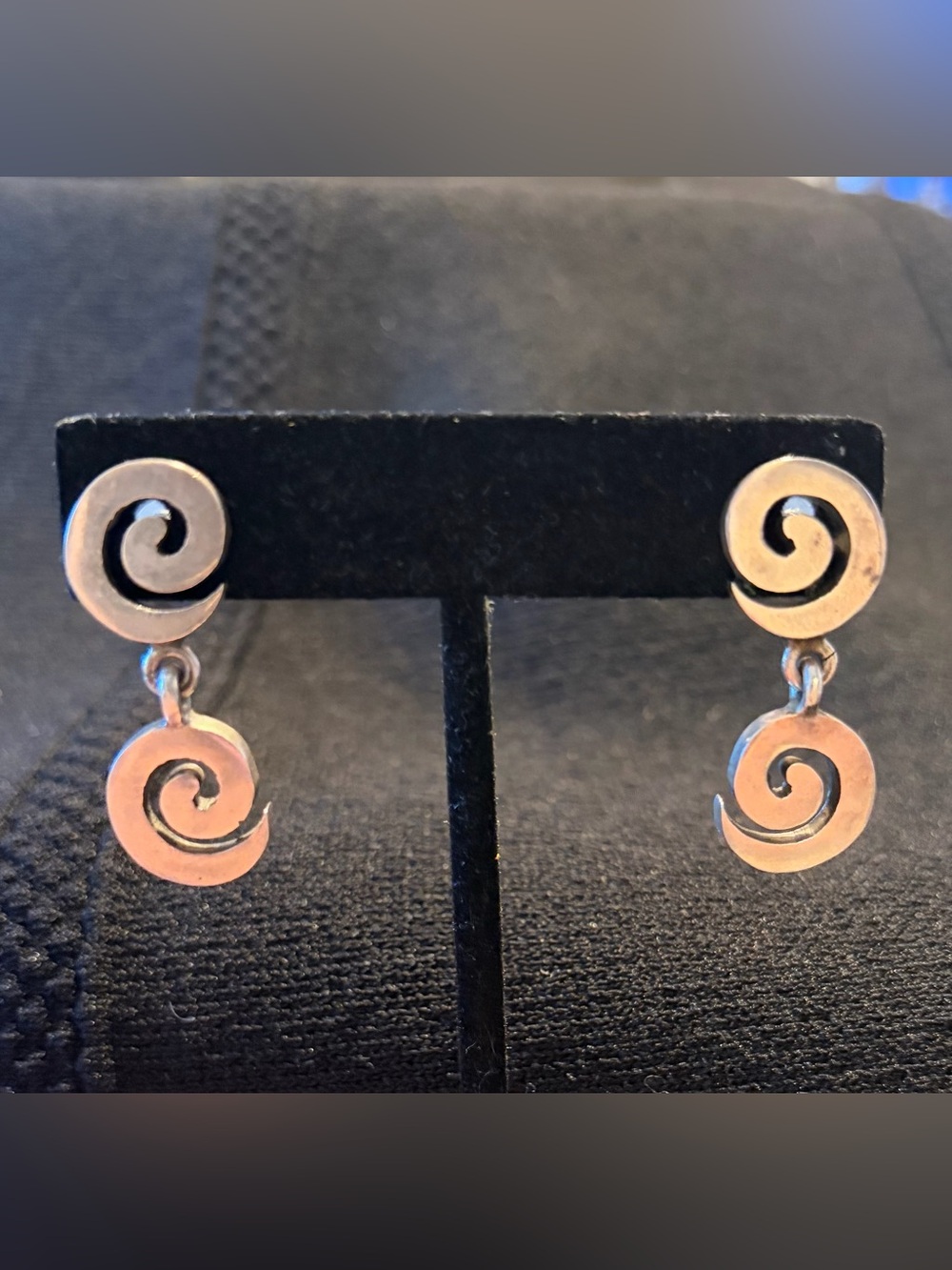 Silver swirl dangle spiral drop earrings.